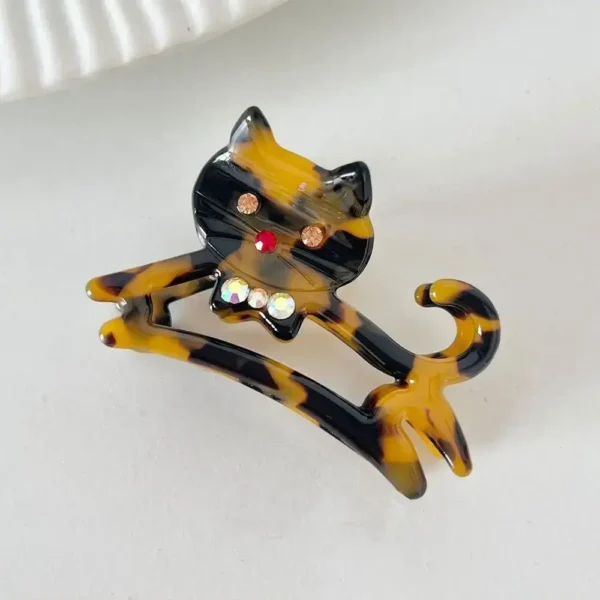 cat hair clip black gold